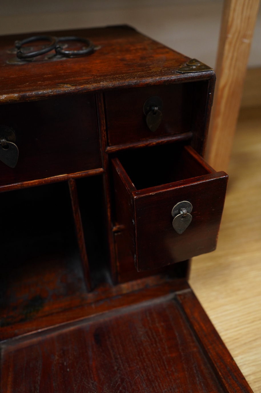 A 19th century Chinese elm scholar's seal cabinet with key, 31cm high. Condition - fair